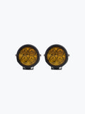 Pair of round yellow motorcycle LED fog lights with black housing on a white background