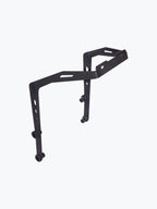 Black metal motorcycle luggage rack bracket with mounting holes isolated on white background