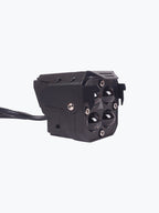 Black motorcycle LED headlight with four lenses and wired connection on white background