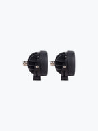 Pair of black motorcycle LED auxiliary lights with mounting brackets on white background