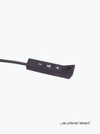 Motorcycle helmet audio controller with volume and playback buttons on white background