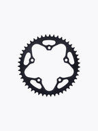 Black motorcycle sprocket gear with teeth, isolated on white background