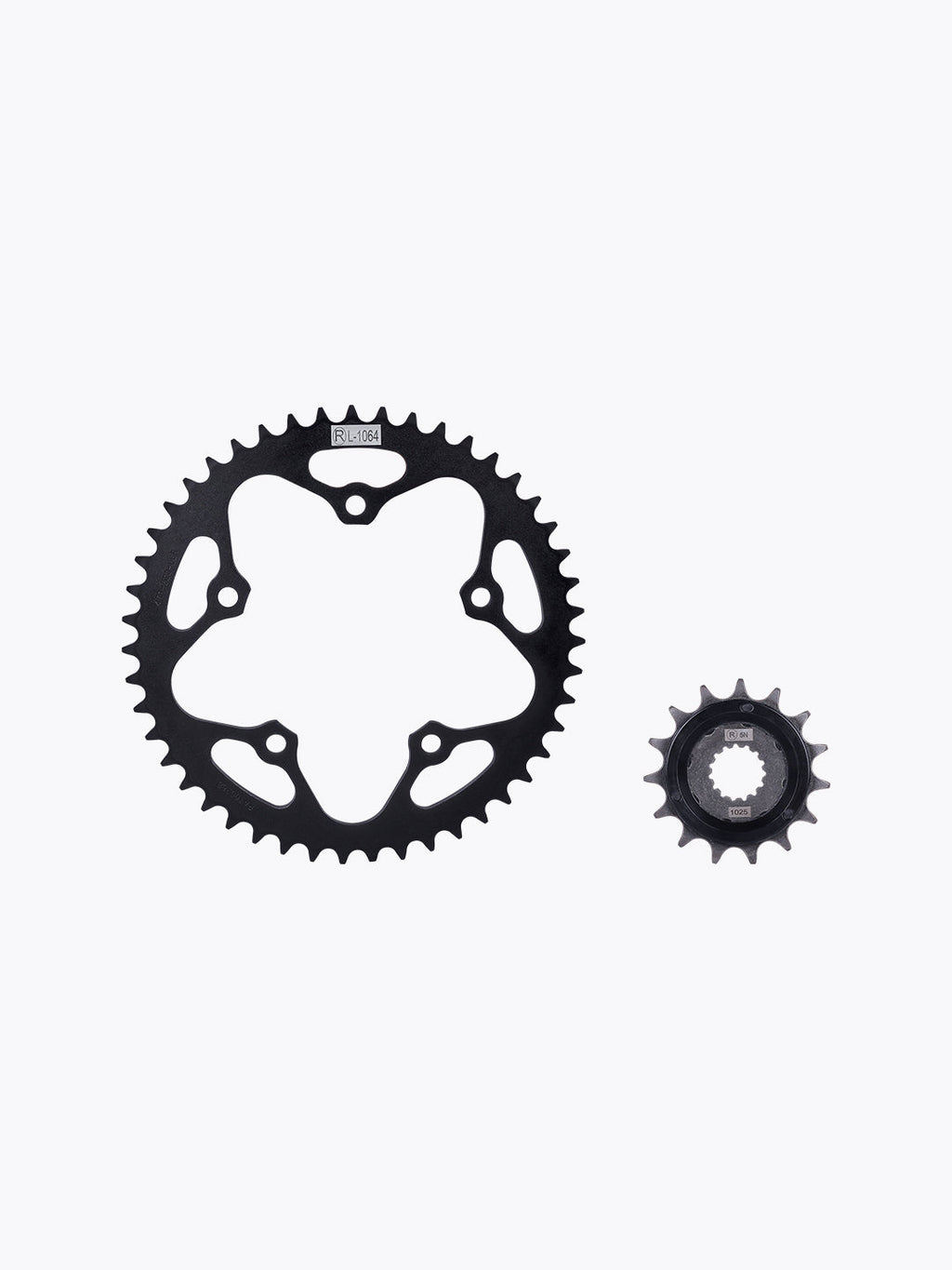 Black motorcycle sprocket set, large and small gears on white background