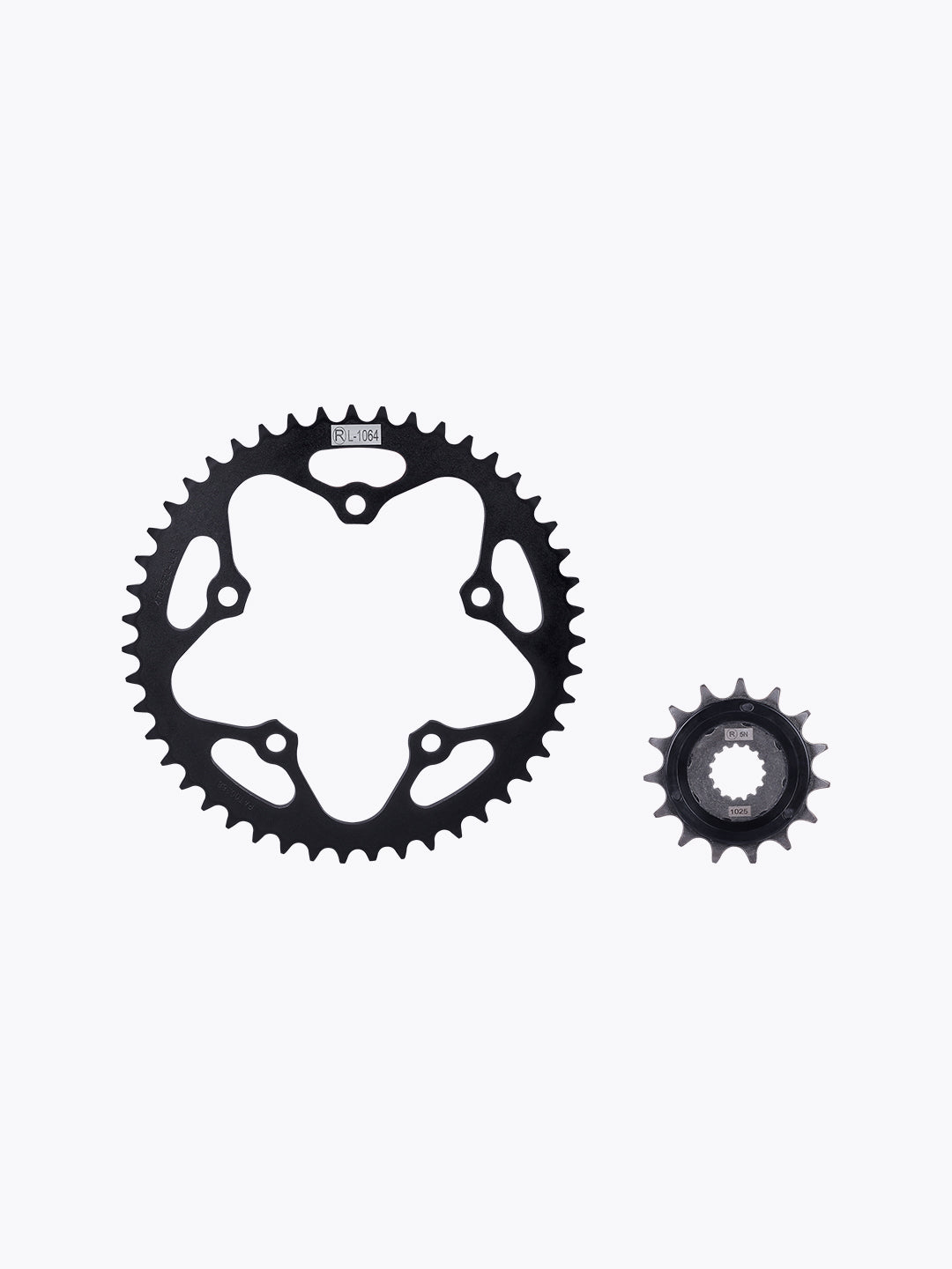 Black motorcycle sprocket set, large and small gears on white background