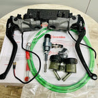 Motorcycle brake and clutch lever kit with hydraulic hoses and accessories on wooden table