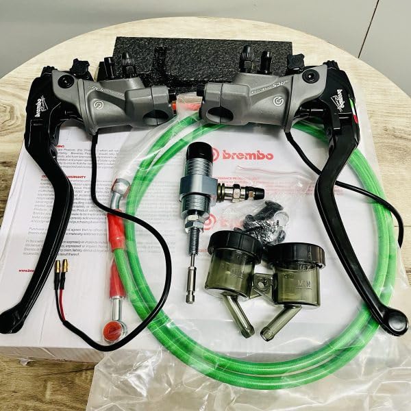 Motorcycle brake and clutch lever kit with hydraulic hoses and accessories on wooden table