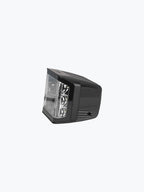 Black motorcycle LED headlight with clear lens, isolated on white background