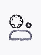 Motorcycle sprocket set with drive chain and gears on white background