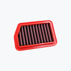 Rectangular motorcycle air filter with red frame and pleated element on white background