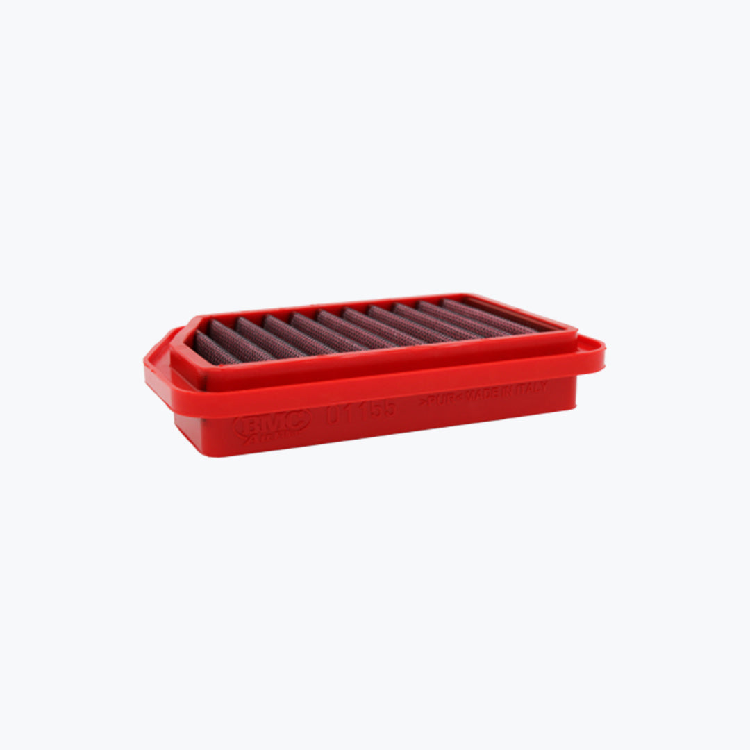 Rectangular red motorcycle air filter with pleated design on white background