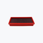 Rectangular red motorcycle air filter on white background
