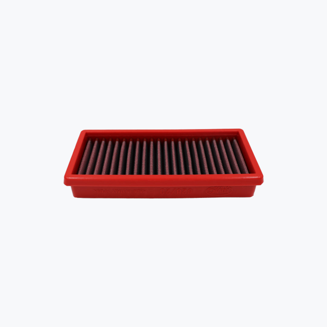 Rectangular red motorcycle air filter on white background