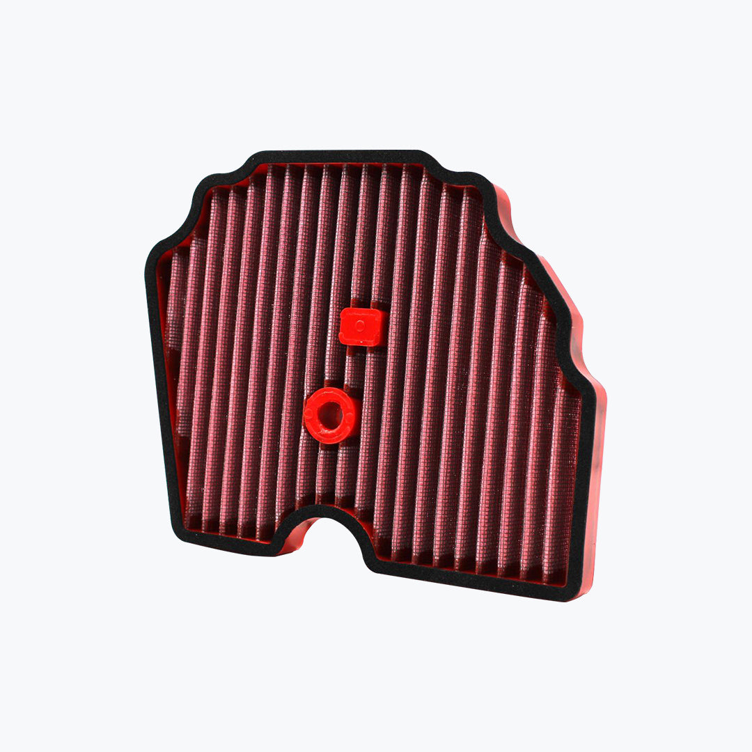 motorcycle air filter with red pleated material and black frame on white background