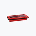 rectangular red motorcycle air filter with pleated design on a light background