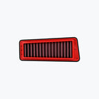 Rectangular red performance motorcycle air filter on white background