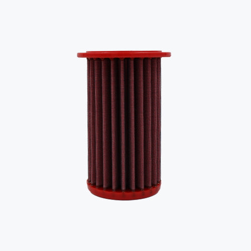 Red cylindrical motorcycle air filter on white background