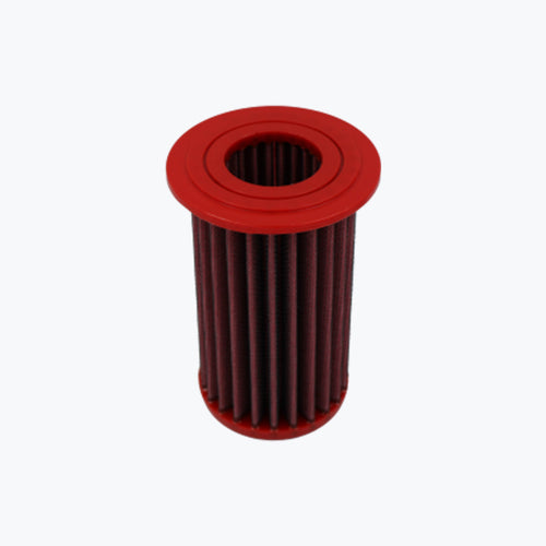 Red cylindrical motorcycle oil filter with pleated design on white background