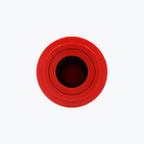Red round motorcycle air filter top view with ribbed interior on white background