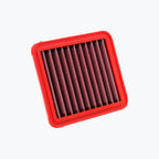 Red rectangular motorcycle air filter with pleated mesh design on white background