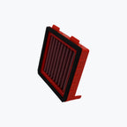 Red motorcycle air filter with black trim isolated on white background