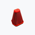 Red pleated motorcycle air filter with hexagonal top on light background