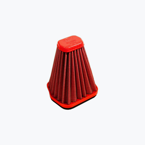 Red pleated motorcycle air filter with hexagonal top on light background