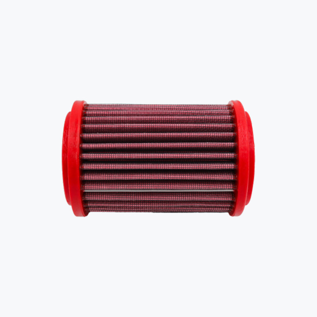 Red cylindrical motorcycle air filter with pleated mesh design on a white background