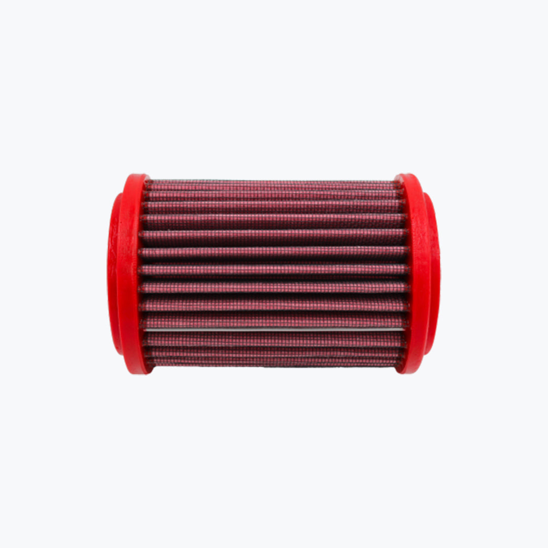 Red cylindrical motorcycle air filter with pleated mesh design on a white background