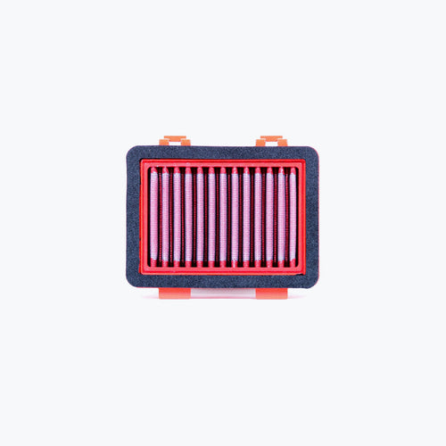 Rectangular motorcycle air filter with red frame and pleated filter element on white background