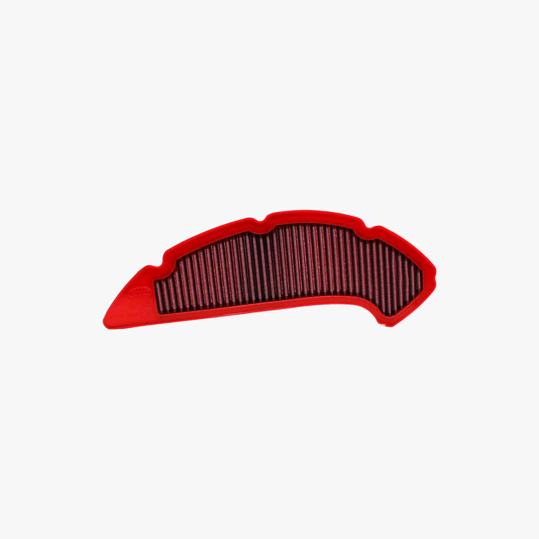 Red motorcycle air filter with pleated design on white background