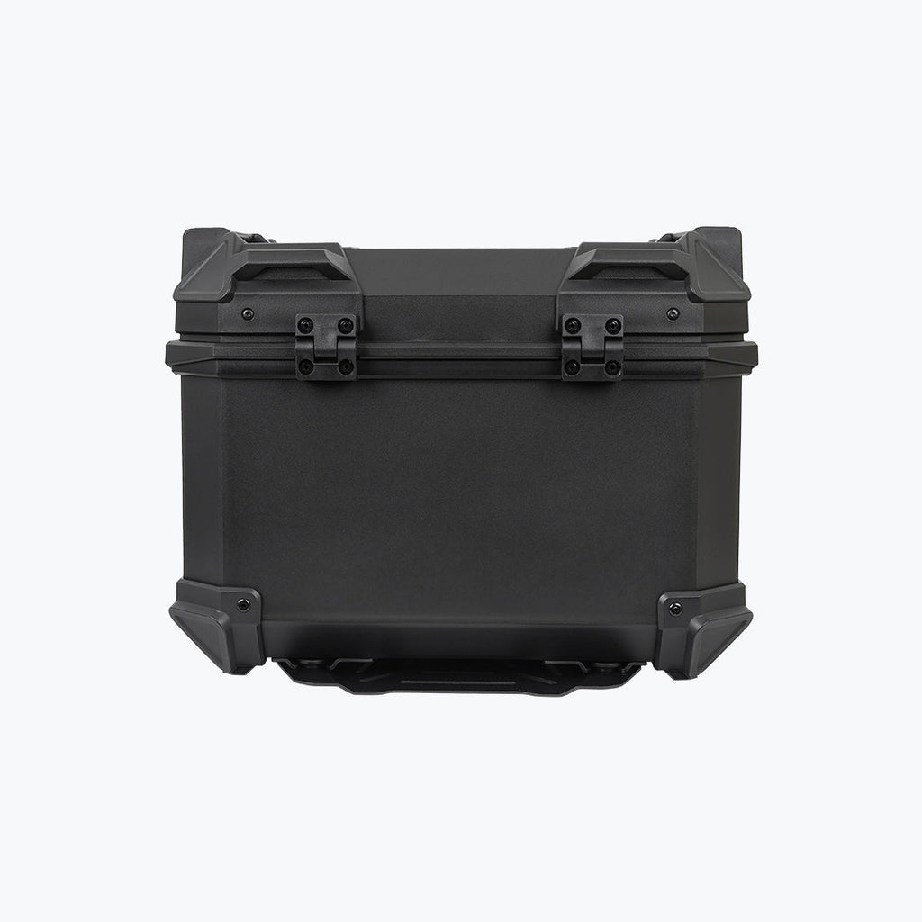 Black motorcycle top box with reinforced corners and backrest pad on white background