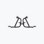 Pair of black motorcycle crash guard bars on a plain light background