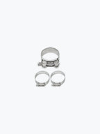 Three stainless steel exhaust clamp bands for motorcycle slip-on silencer, isolated on white.