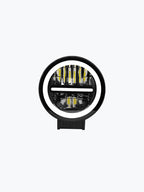 Round LED fog light with blue ring, center bar, and clear lens for vehicles