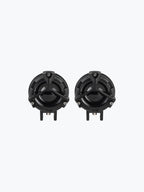 Pair of round black motorcycle fog lights with protective grills on white background