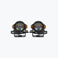 Pair of round LED motorcycle fog lights with mounting brackets on white background