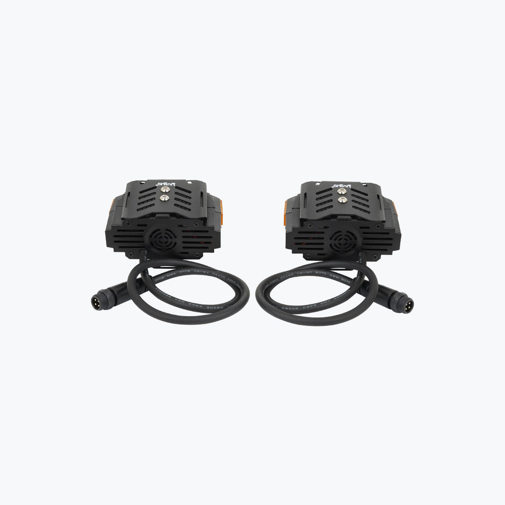 Pair of black motorcycle LED auxiliary lights with attached cables on white background