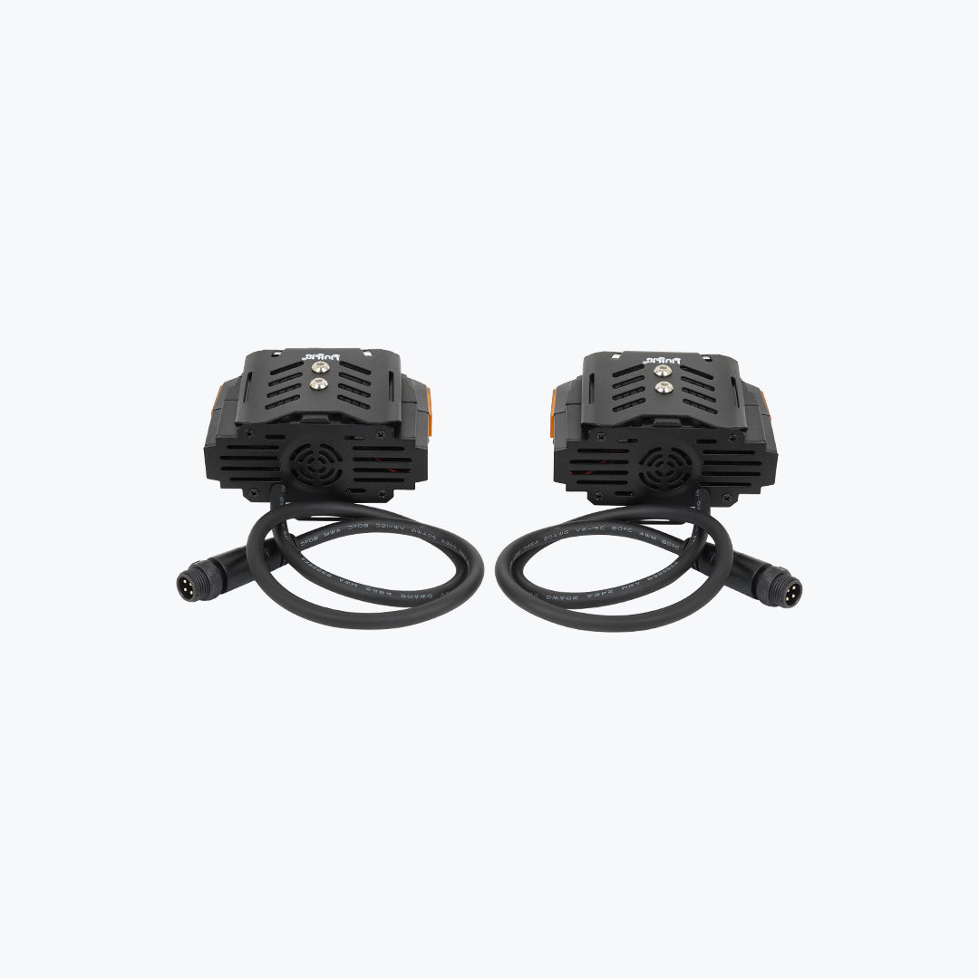 Pair of black motorcycle LED auxiliary lights with attached cables on white background