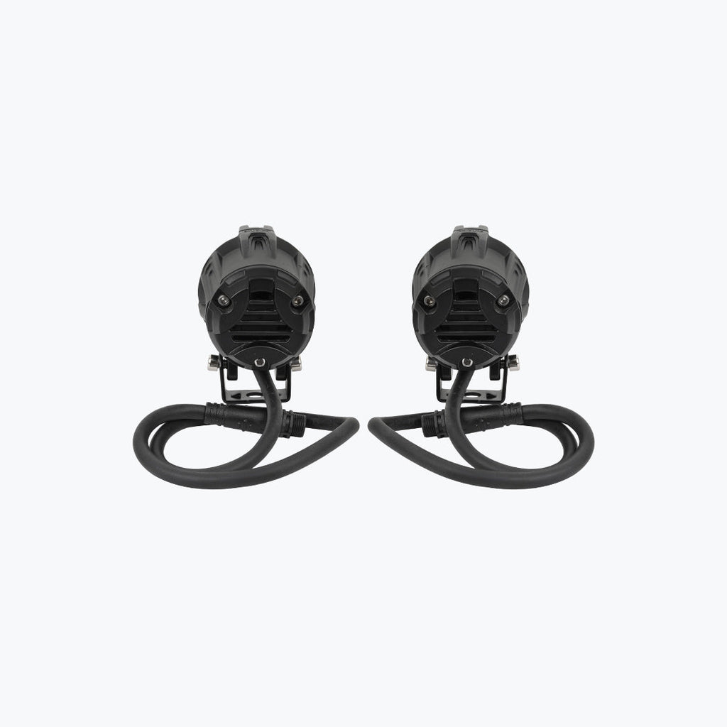 Pair of black LED motorcycle auxiliary lights with cables on a white background
