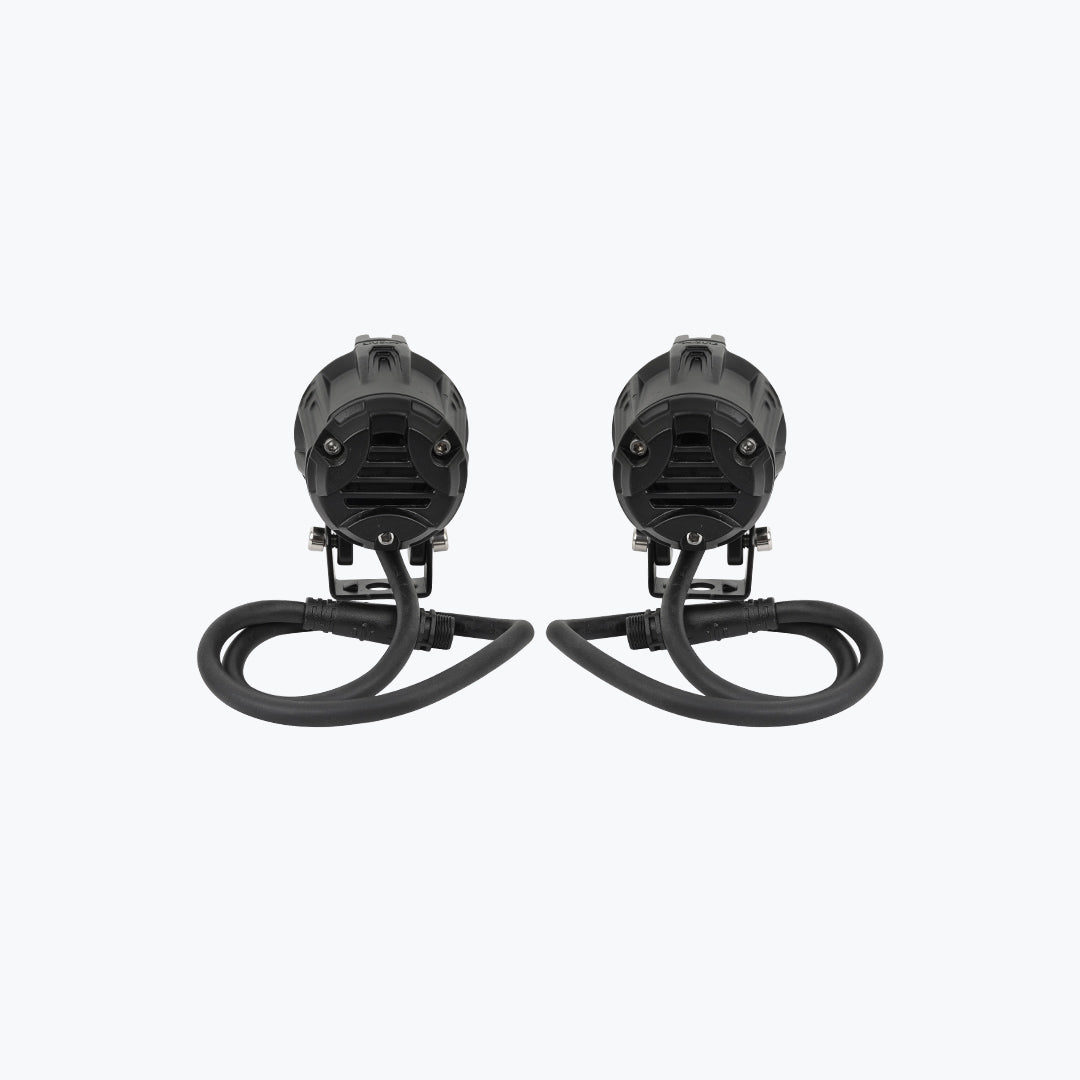 Pair of black LED motorcycle auxiliary lights with cables on a white background