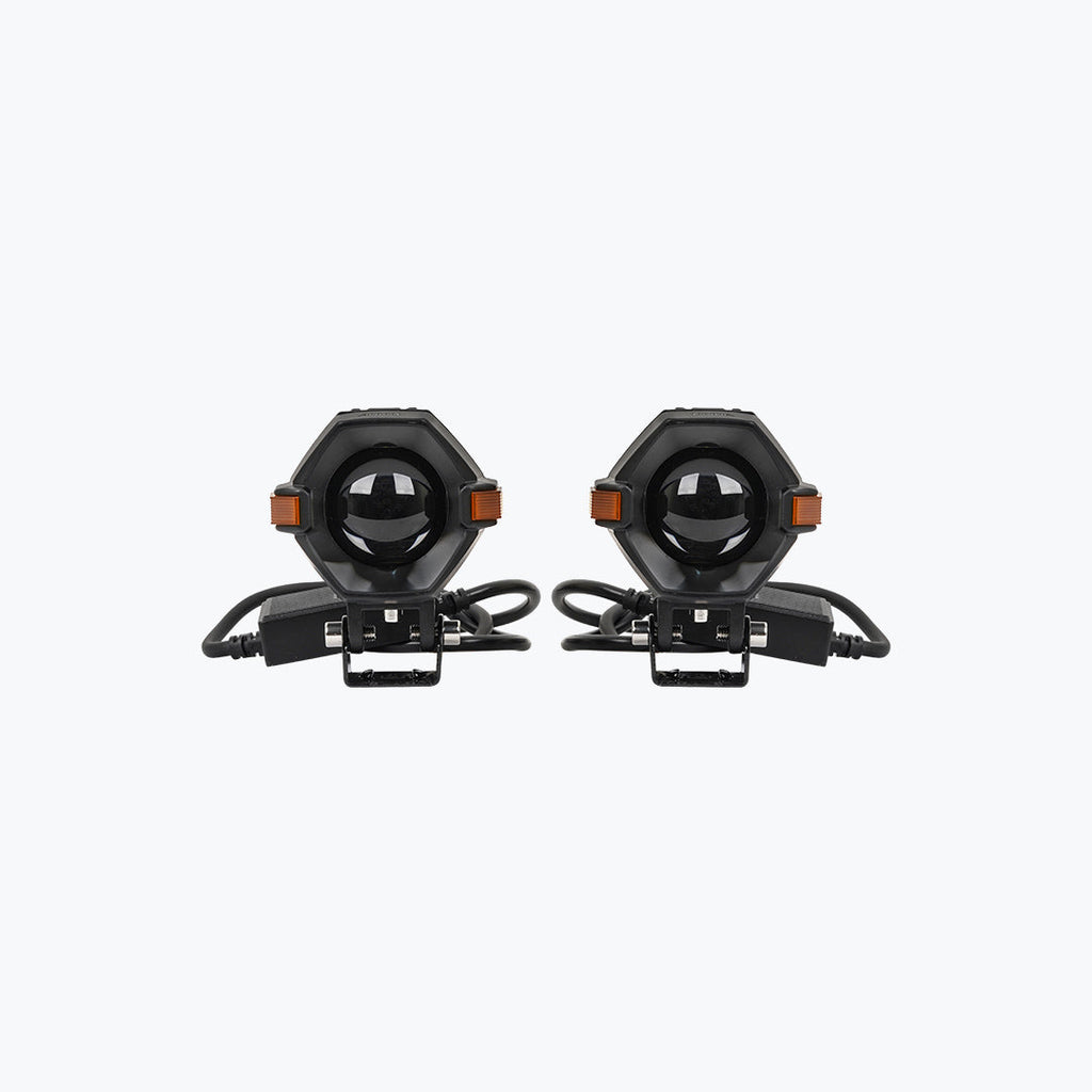 Pair of black motorcycle LED auxiliary lights with mounting brackets and cables on white background