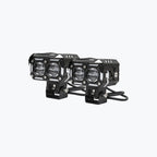 Pair of black dual-LED motorcycle auxiliary lights with protective metal housing