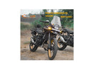 Adventure motorcycle with polycarbonate visor, golden alloy wheels, outdoor setting