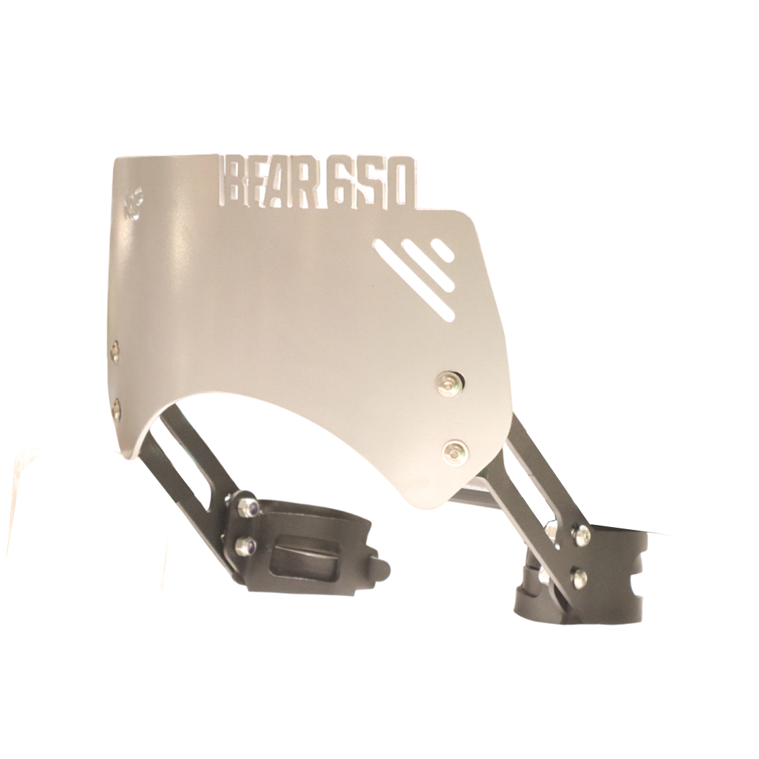 Metal motorcycle windscreen with 'BEAR 650' cutout, mounting brackets visible