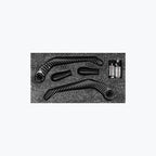 Carbon fiber motorcycle lever guards and handlebar grips set on black foam