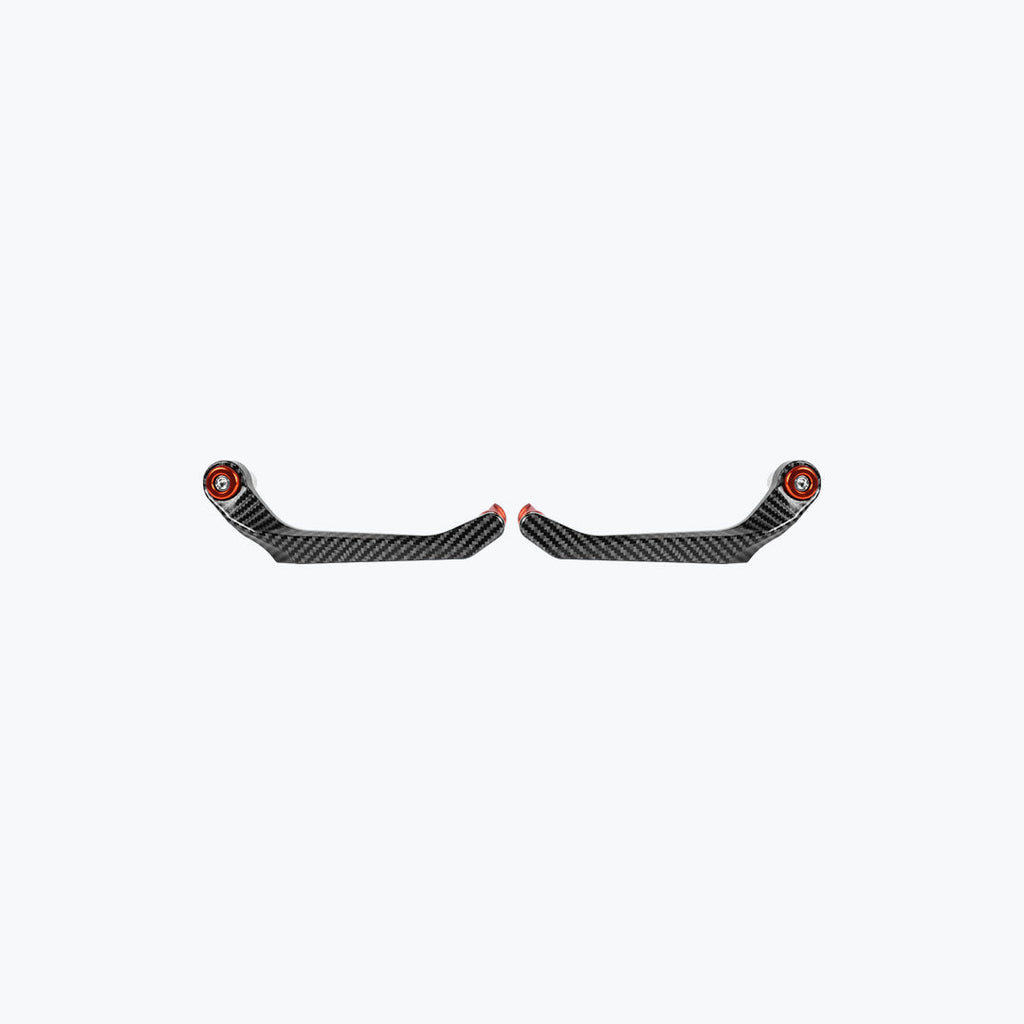 Pair of carbon fiber motorcycle brake and clutch lever guards with red accents on white background