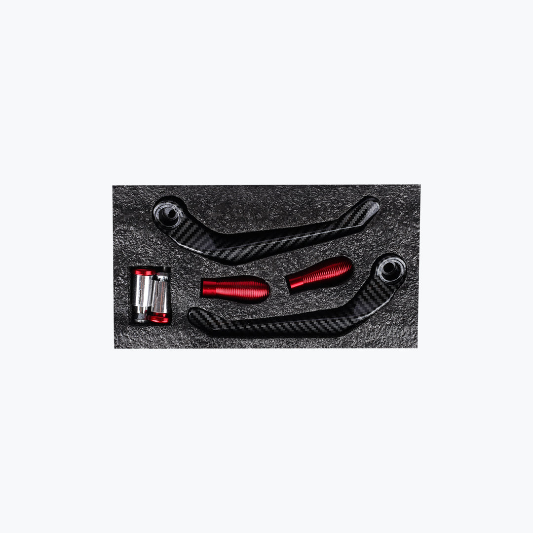 Carbon fiber motorcycle lever guard set with red aluminum components in foam packaging
