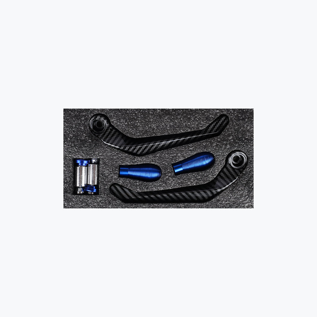 Carbon fiber motorcycle lever guards and blue aluminum handlebar ends set on foam insert