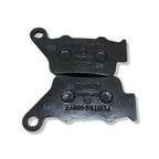 Pair of black Brembo motorcycle brake pads with engraved part numbers on white background