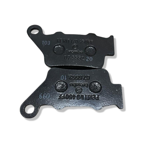 Pair of black Brembo motorcycle brake pads with engraved part numbers on white background